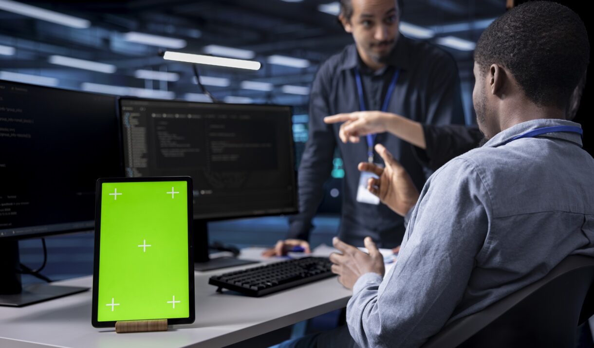 multiethnic team using green screen tablet to over mvkf9j9.jpg